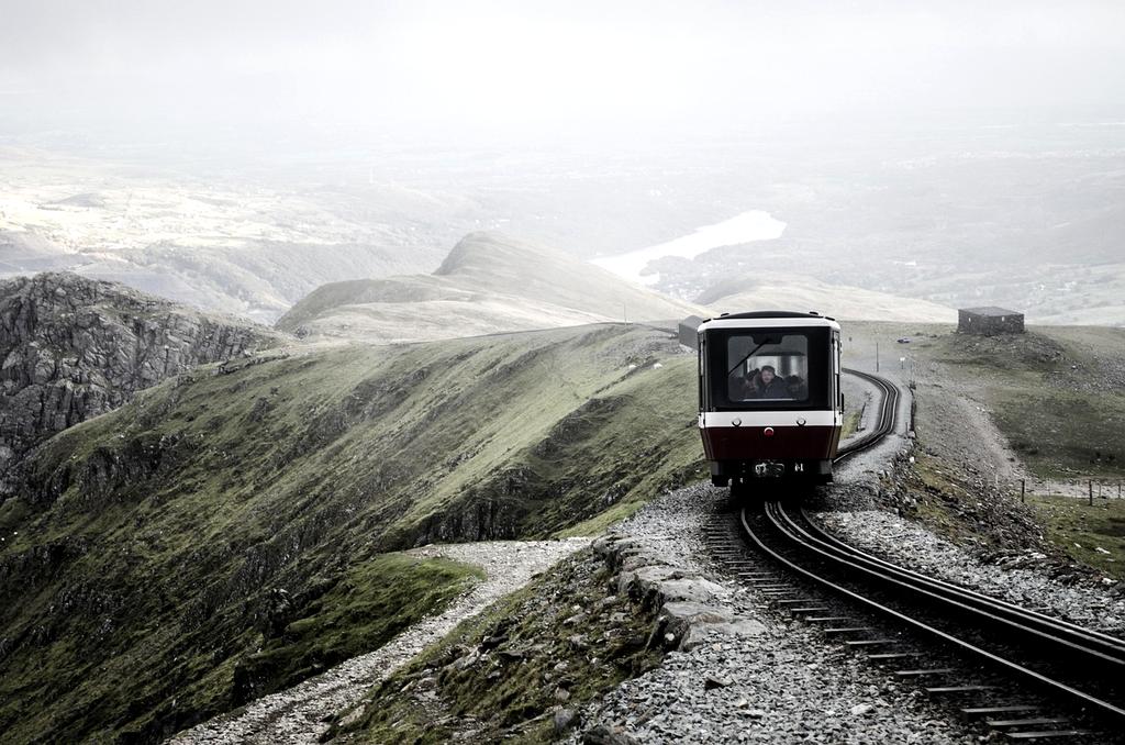 Snowdon mountain peak rising above clouds in Wales